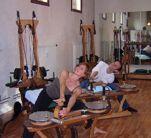 Instructor Deb working with client Andreas during a GYROTONIC session